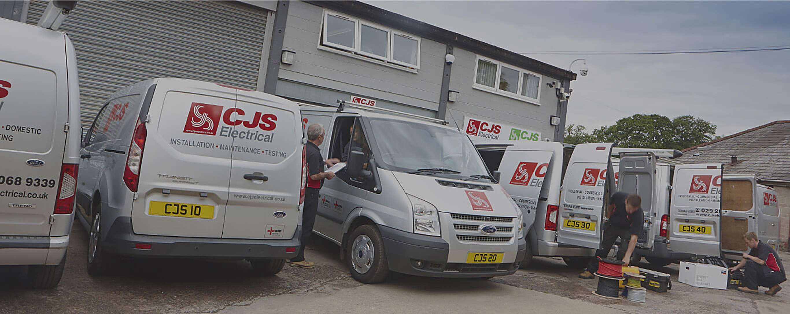 CJS Electrical engineers and vans at the company workshop in Cardiff.