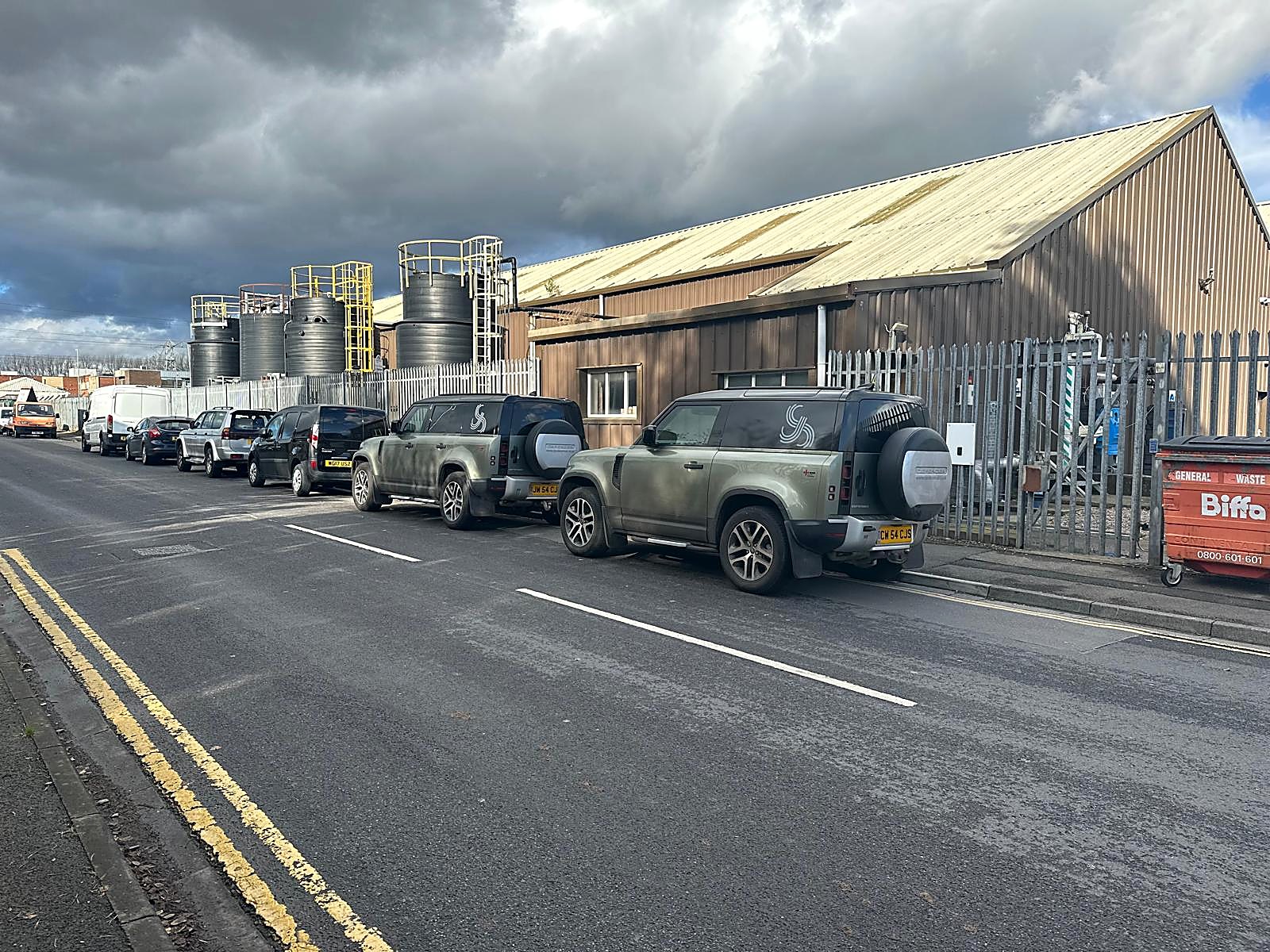 CJS Electrical vehicles parked outside the yard in Cardiff.