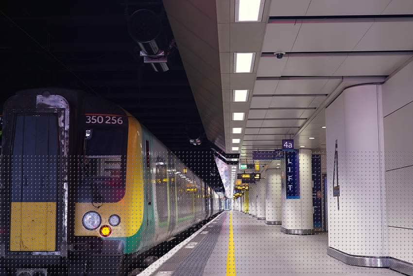 Lighting scheme installed across a large UK transport concourse.